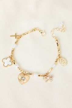 Elevate your everyday look with this versatile gold charm bracelet. Its adjustable design ensures a perfect fit, while the delicate gold chain adds uniqueness. Perfect for layering or wearing solo, this bracelet is a must-have for any jewelry collection. Jewelry Bracelets Gold, Beaded Jewelry Designs, Gold Charm Bracelet, Gold Band Ring, Girly Jewelry, Altar'd State, Dream Jewelry, Gold Filled Jewelry, Pretty Jewellery