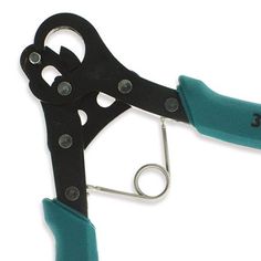 a pair of black and green scissors on a white background with clippings attached to the handles