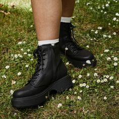 Amp up your style! ✨🖤 Get ready to rock the world with the Bingo Black Platform Boot. Bold & beautiful: Black faux leather, webbing, and lycra upper for a rebellious look. Sky-high style: Chunky platform sole and 2.08-inch heel for a serious boost. Lace-up love: Classic lace-up closure for a secure and customizable fit. Comfy kicks: Plush foam insole that cushions your every step. Everyday versatility: Pair these boots with everything from skinny jeans to flowing dresses. Rocket Dog women's boot Style: Lace up platform boot Upper: Black faux leather, webbing and lycra Lining: Microfiber Sole: Rubber platform Heel height: 2.08 inches Shaft height: 5.5 inches Shaft circumference: 9 inches Closure type: Lace up Black Synthetic Alternative Platform Boots, Alternative Style Synthetic Platform Boots For Concerts, Punk Synthetic Boots For Concerts, Black Synthetic Alternative Style Boots, Casual High Ankle Platform Boots For Concert, Synthetic Punk Platform Boots For Concerts, Alternative Synthetic Boots For Concerts, Alternative High-top Synthetic Boots, Alternative Style Synthetic Boots For Concerts