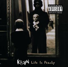 the album cover for korn life is peachy, which features an image of two children