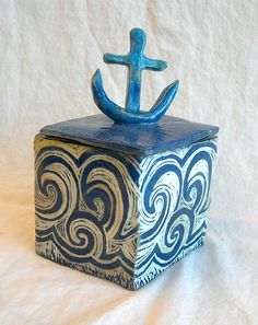 a blue and white box with an anchor on it