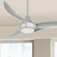 a white ceiling fan in a room