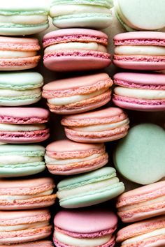 many macaroons are stacked on top of each other