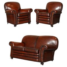 three brown leather chairs sitting next to each other