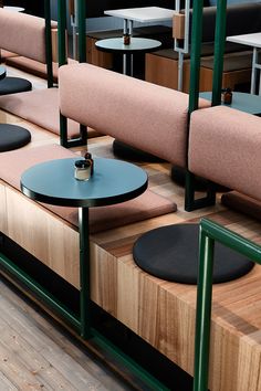 several tables and chairs are lined up against each other in a room with wood flooring