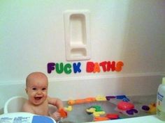 a baby sitting in a bathtub with toys around it and the words flickr bits on the wall