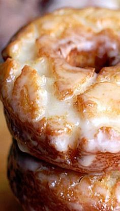 two glazed donuts stacked on top of each other