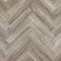 an image of wood flooring that looks like chevron herringbones in grey tones