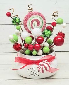 a bowl filled with candy and candies on top of a table