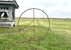 This wrought iron peace sign can be used outdoors to stake in your yard. We have 3 sizes and this is the lg one - check our etsy store for the other sizes.  This is handmade sign is welded to last. Notice we carry wall hanging Peace Signs in our Etsy Store.  ⚜️SIZE: Measures 24" diameter with a 9" stake to anchor into your ground.   ⚜️COLOR CHOICES:  You have a choice of the original rusty finish or add some color to your piece by choosing from our many paint color options! We can paint it in a full coat option with one of our 20 Rust-oleum colors OR we can do a vintage style brushed paint finish. Upon purchase of the product with the Rust-Oleum paint option, we Prime the item with a coordinating Primer then Topcoat it with you Rust-Oleum color choice. You will get a Great Product with a G Dry Brush Technique, Lawn Art, Fencing & Gates, Art Statue, Handmade Sign, Peace Signs, Front Lawn, Rustic Colors, Garden Trellis