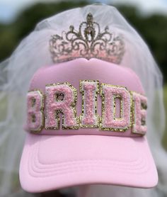 Bridal hat for the bachelorette party This trucker hat in pink is branded in pink chenille letters spelling "bride."  A sparkling crown sits on top of the hat with long layers of pink tulle falling down.  This hat is perfect for the rehearsal dinner, reception after the wedding, and of course the bachelorette party!!  DereeCouture can make other colors or incorporate your design. Hat Bar, Dinner Reception, Chenille Patches, Bachelorette Ideas, Bride Hat, Bridal Hat, Patch Hat, Hat Ideas, Pink Vibes