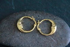 GOLD MOON CRESCENT HOOP EARRINGS - 22x20mm Bohemian pair of Gold hoop earrings, featuring a Moon Crescent. Lovely, boho design. Great for everyday wear, easy to put on and off. High quality Gold, bright, shiny. Micro Pave Clear Cubic Zirconia detail. Please note the size of this model: these are small-medium hoops, with a 22mm diameter. Each hoop of this pair only weights 2g. This listing is also available in PLATINUM: https://chandramalajewellery.etsy.com/listing/1651876686 SEE MORE HOOPS HERE: https://www.etsy.com/au/shop/ChandraMalaJewellery?ref=seller-platform-mcnav&search_query=hoops Description 18k Gold Cubic Zirconia detail Size: about 22mm long and 20mm wide Thickness: 3mm thick Pin: 0.7mm TO GO BACK TO MY STORE CLICK HERE:  https://chandramalajewellery.etsy.com * Cheap Vintage Small Hoop Jewelry, Cheap Crescent Hoop Earrings, Cheap Bohemian Small Hoop Jewelry, Cheap Vintage Pierced Hoop Earrings, Cheap Bohemian Small Hoop Earrings, Affordable Bohemian Small Hoop Earrings, Luxury Brass Crescent Jewelry, Moon Hoop Earrings, Celestial Yellow Gold Hoop Earrings