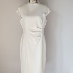 Lauren Ralph Lauren Side Ruched Texture Sheath Dress Cap Sleeve High Neck Lined Stretch White Polyester Blend Condition Is Pre-Owned In Excellent Condition. Please Note: *The Real Color Of The Item May Be Slightly Different From The Pictures Shown On Website Caused By Many Factors. *Don't Go By Size Number. Do Check Measurements To Determine If The Item Will Fit. Measurements: Approximately (Laying Flat). -Shoulder To Shoulder: 20 Inches (Shoulder Seam To Shoulder Seam) -Armpit To Armpit: 20 Inc Classic Fitted Ruched Dress, Cream Dresses With Pleated Waist And Fitted Design, Classic White Dress With Pleated Waist, Fitted Dress With Pleated Back And Cap Sleeves, Classic Lined Sheath Dresses, Classic Sheath Lined Dresses, Elegant Dresses With Pleated Waist And Cap Sleeves, Elegant White Cap Sleeve Dress, Elegant Ruched Cap Sleeve Dresses