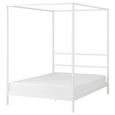 a white metal bed frame with no sheets