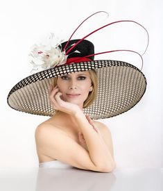 2019 spring collection. Large oversized off white hat covered with black mesh material . Adorned with hand made feather flower and quills. One of the kind. Was featured on a few news channels and runway shows. Limited edition Luxury Straw Hat For Formal Kentucky Derby, Luxury Vintage Top Hat For Kentucky Derby, Luxury Straw Hat For Kentucky Derby And Church, Luxury Hats With Pinched Crown For Events, Luxury Flat Crown Top Hat For Kentucky Derby, Luxury Hats For Kentucky Derby, Luxury Classic Brimmed Costume Hats And Headpieces, Luxury Formal Costume Hat With Pinched Crown, Luxury Brimmed Panama Hat For Kentucky Derby