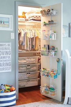 a baby's closet with an open door