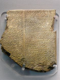 a piece of ancient writing on display in a case