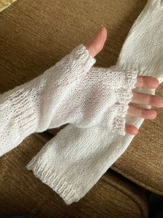 Hand knitted white fingerless arm warmers.  Designed to keep arms and hands warm both indoors and out and keep fingers free.  The ribbing is not too tight so it will fit over the elbows and not fall down but won't be uncomfortable.   Knitted in machine washable yarn in white (more colours coming) and made to fit an adult of medium size. Will fit under or over a top. White One-size Knitting Pattern, Cozy White Leg Warmers, Cozy Comfortable White Leg Warmers, Cozy White Soft Knit Pattern, White Stretch Warm Leg Warmers, White Stretch Leg Warmers, White Stretch Knitted Leg Warmers, White Stretch Knit Leg Warmers, White Soft Warm Leg Warmers