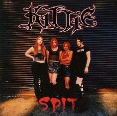 four girls standing in front of a garage door with the word's on it