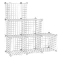 four white wire baskets stacked on top of each other