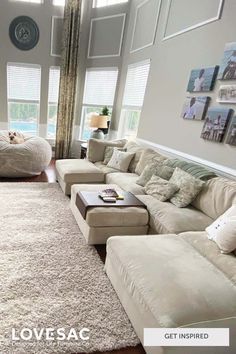 a living room filled with furniture and lots of windows