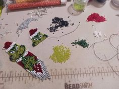 These earrings are based on a beloved Christmas character. Whimsical Beaded Earrings As A Gift, Handmade Jewelry For Christmas Crafting, Handmade Themed Earrings For Gift, Themed Drop Earrings For Gifts, Loom Designs, Beaded Projects, Bead Loom Designs, Christmas Bead, Beaded Earrings Patterns