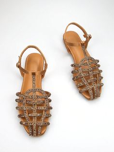 Elevate your style with our Gorgeous Rhinestone Sandals. Made with light brown sardine fabric and featuring a braided ankle strap, these flats are perfect for both daily wear and parties. The sparkling rhinestones add a touch of glam to any outfit. Order now for a stunning look. Color : Brown Toe : Open Toe Details : Buckle Upper Material : Satin Lining Material : PU Leather Insole Material : PU Leather Outsole Material : TPR Size US Ball Girth Foot Length Heel Height EUR35 US5 20.5 22.06 1.1 EU Brown Flat Sandals For Evening, Brown Embellished Sandals For Party, Brown Embellished Party Sandals, Party Brown Embellished Sandals, Brown Embellished Summer Sandals, Strap Flats, Frida Kahlo Art, Embellished Flats, Ankle Strap Flats