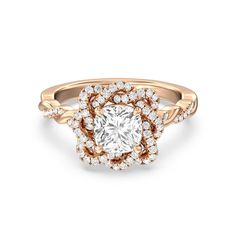 a rose gold engagement ring with an oval center surrounded by round diamonds