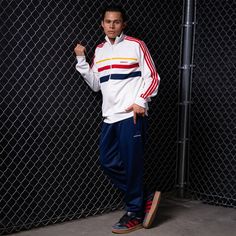 Take your style back in time with the retro-looking adidas Sport Leaf First Men's Track Jacket. While the colors give it that throwback look, the soft material will keep you comfortable, even when you have a long day ahead of you. And this jacket has a relaxed fit, allowing you to layer it with a tee or sleeveless or lightweight, long-sleeved shirt.Easy to layer. Fitted hem and cuffs. Features side pockets. Long-sleeved. Zip-up. Machine washable. Retro Track Jacket With Ribbed Cuffs For Streetwear, Retro Streetwear Track Jacket With Ribbed Cuffs, White Long Sleeve Track Jacket With Adidas Logo, White Long Sleeve Adidas Track Jacket, White Track Jacket With Three Stripes For Streetwear, White Casual Track Jacket With Three Stripes, Casual White Track Jacket With Three Stripes Branding, Casual White Track Jacket With Three Stripes, Casual Three Stripes Track Jacket With Long Sleeves