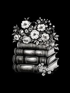 a stack of books with flowers and leaves on top of them, against a black background