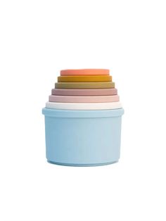 stack of pastel colored bowls against a white background