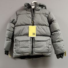 An Ultra-Warm Puffer Made With A Partially Fleece-Lined Interior Helps Him Take On Cold-Weather Activities In Complete Comfort. A Water- And Wind-Resistant Construction Is Built For A Stay-Dry Feel While Keeping The Cool Air Out. Our Zipper Stabilizer Allows For Easier Self Fastening Of The Jacket, And An Elastic Around The Inner Part Of The Hood Provides A Snugger Fit. This Jacket Has Been Thoughtfully Created With Mittens That Pull Out From The Thumbhole Cuffs, Along With Extendable Sleeves Th Gray Puffer Jacket With Pockets For Cold Weather, Solid Winter Outerwear For School, Fall School Outerwear With Pockets, Cold Weather Activities, Weather Activities, Kids Pattern, All In Motion, Boys Coat, Thumb Holes