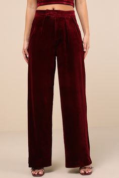 The perfect look for a holiday party includes the Blank NYC Sneak Peak Burgundy Velvet High-Rise Trouser Pants! Luxe velvet shapes these sensational pants with a high-rise fit and a stitched waistband with dual, hidden snap button closures atop a hidden zip fly. The straight pant legs feature pleated details, diagonal front pockets, and decorative welt pockets at back before ending at full-length hems. Fit: This garment fits true to size. Length: Floor length. Size 28 Inseam: 41.25 Front Rise: 1 Elegant Burgundy High-waisted Wide Leg Pants, Chic Velvet Wide Leg Pants, Chic Velvet Trousers, Velvet Wide Leg Pants For Work, Chic Wide-leg Velvet Pants, Velvet Wide Leg Bottoms For Night Out, Full-length Velvet Bottoms For Night Out, Full Length Velvet Bottoms For Night Out, Elegant Bottoms For Holiday Night Out