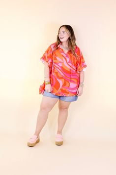 Introducing our vibrant 'Fun and Free' top, a must-have for your wardrobe! Designed with a playful orange and pink palette, this flowy top exudes charm with its ruffled sleeves and trendy tie neckline. Ideal for any occasion, its half-sleeve length ensures comfort while maintaining your stylish flair. Elevate your look effortlessly and embrace a carefree vibe with this versatile piece. Model: Abby is wearing a size M/L. Maci is wearing a size 1XL/2XL. Nancy is wearing a size 1XL/2XL. Size Sugges Pink Palette, Giddy Up Glamour, Orange And Pink, Flowy Top, Pink Design, Ruffled Sleeves, Flowy Tops, Shine Bright, Half Sleeve