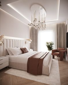 a bedroom with a large bed and chandelier hanging from it's ceiling