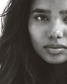 a black and white photo of a woman's face