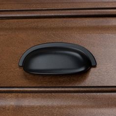 These GlideRite cabinet pulls are an easy way to update your home's decor without a major overhaul. The modernized shape of these bin cabinet pulls is easy to grip and works equally well with both contemporary and traditional decors. The color of the matte black finish adds a classic feel to the room. Every pull is packaged individually to prevent damage to the finish and come with standard #8-32 x 1 in. installation screws for easy installation. 3-1/2 in. L x 1-1/2 in. W x 7/8 in. projection 2-1/2 in. screw spacing Matte black finish Made of zinc alloy #8-32 thread x 1 in. long screw(s) are included Features Item Weight 1.7 oz Style Classic Hardware Finish Family Black Cabinet Pull Type Cup Pull Package Quantity 10 Features No Additional Features Material Zinc Style2 Classic,Modern,Transi Bin Cabinet, Classic Cabinets, Black Cabinet Hardware, Classic Cabinet, Black Drawer Pulls, Black Drawers, Single Handle Kitchen Faucet, Cup Pulls, Undermount Kitchen Sinks