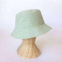 The perfect linen bucket hat! Made from a mint green linen blend fabric. This hat is very comfortable to wear. A great sun hat for women or men. I made this hat with a day of adventure in mind, somewhere sunny and wild! For baby or kid version of this hat, see link below. This hat is made from a mint green linen and cotton blend fabric. Inside liner is white cotton. Interfacing inside brim for extra shape. Brim measures approx. 2.5" wide. Crown measures approx. 3.5" deep. **Hat on models in diff Custom Fitted Hats, Sun Hats For Women, Summer Linen, Hat For Women, Sun Hat, Fitted Hats, Sun Hats, Custom Fit, White Cotton