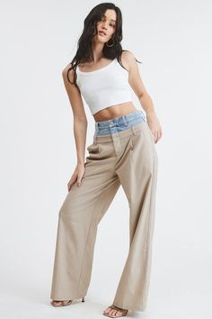 Introducing our one-of-a-kind Billie Trousers, where casual meets dressy in perfect harmony.These trouser pants are designed with a unique Peek-a-boo denim wash waistband that adds a playful twist to the sophisticated pinstripe pattern. Complete with functioning front pockets and belt loops on both the denim and pants, they seamlessly blend style and practicality. PRE ORDER APRIL 26TH Fabric & fit: SELF: 69% POLYESTER 29% RAYON 2% SPANDEXCONTRAST: 100% COTTONModel is wearing size Small. Chic Elevated Casual High-waisted Pants, Chic High-waisted Pants For Elevated Casual Occasions, Wide-leg Denim Bottoms For Elevated Casual, Wide-leg Denim Pants For Casual Wear, Elevated Casual Denim Wide-leg Pants, Mid-rise Wide Leg Pants For Spring Day Out, Elevated Casual Wide-leg Summer Bottoms, Fitted Wide-leg Denim Jeans, Mid-rise Wide Leg Pants For Spring