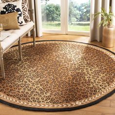 a leopard print rug is shown in front of a window with curtains and a chair