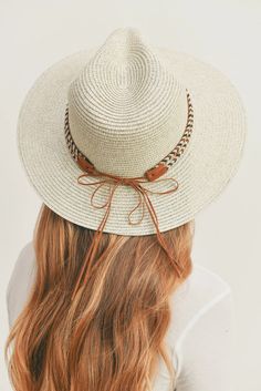 Add a touch of boho charm to your look with this stylish Straw Panama Fedora Hat! Quality crafted and accented with a Boho embroidered band, this hat is the perfect way to stay looking cool and on-trend. Plus, the suede tie accent gives it a unique touch! Material: 100% paper straw Circumference: 22" Brim length: 3.25" Chic Adjustable White Hat Band, Chic White Adjustable Hat Bands, Bohemian Adjustable Boater Hat For Summer, Adjustable Bohemian Boater Hat For Summer, Brown Woven Hat Bands For Spring, Chic Brimmed Braided Sun Hat, Chic Braided Brimmed Sun Hat, Chic Braided Sun Hat With Curved Brim, Chic Braided Hats For Vacation