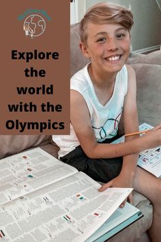 a young boy sitting on a couch holding a pencil and paper with the words explore the world with the olympics