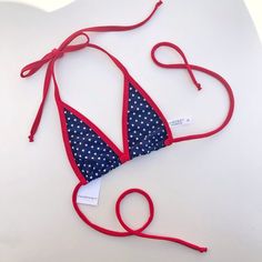 TOP ONLY! This is our extreme micro Blue Bikini Top with White Polka Dots and Red Trim! Made with love in California! 80% Nylon, 20% Spandex --------------------------------------------------------------------------------------------------- All custom orders are made to fit your shape and are final. No exceptions. See more on our website: fahrenheitswimwear.com Follow us on Instagram: @fahrenheitswimwear Christina Aguilera Costume, White Polka Dot, Fourth Of July, Custom Orders, Red And White, Polka Dots, Dots, California, Spandex