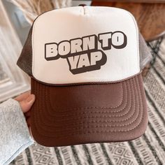 Embrace your chatty side with this stylish and fun trucker hat. Featuring the playful phrase, "Born to Yap," this hat is perfect for those who love to keep the conversation going and share their thoughts with the world. Whether you're out with friends or just running errands, this hat is sure to be a fun addition to your wardrobe. ♥ Stay cool and stylish with our classic 5-Panel High Crown Mesh Back Trucker Hat. ♥ The breathable mesh back ensures comfort, while the seamless foam front panel prov Brown Trucker Baseball Cap With Letter Print, Fun 5-panel Hat With Letter Print, Novelty Snapback Hat With Letter Print And Curved Brim, Trendy Trucker Hat With Letter Print And Flat Brim, Funny Snapback Hat With Letter Print, Funny Snapback Cap With Letter Print, Trendy Flat Brim Trucker Hat With Letter Print, Trendy Letter Print Flat Brim Trucker Hat, Retro 5-panel Hat With Letter Print