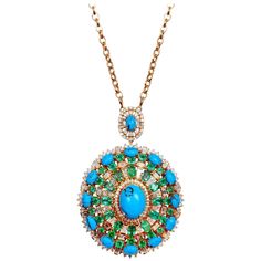 Cast from 14-karat gold, this pendant necklace is hand set with 16.00 carats turquoise, emerald and 5.60 carats of sparkling diamonds. FOLLOW MEGHNA JEWELS storefront to view the latest collection & exclusive pieces. Meghna Jewels is proudly rated as a Top Seller on 1stDibs with 5 star customer reviews. All items manufactured by us are handmade and can be customized or redesigned. Composition Total Weight - 44.57 grams 14k Gold - 40.25 grams 5.60 Ct Diamond 16 Ct Turquoise & Emerald Pendant Size 41.66 x 19.79 mm Chain 31 Inches Diamond Chain Necklace, Turquoise Pendant Necklace, Emerald Pendant, Gold Diamond Necklace, Necklace Wedding, Diamond Chain, Gemstone Jewelry Handmade, Yellow Gold Chain, Rose Gold Necklace