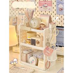 an assortment of items is displayed on a shelf in front of a wallpapered background