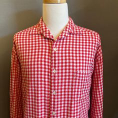 "You are viewing a very cool Vintage Men's Cotton Gingham Shirt by Structure c1990s. This great looking shirt is made of a distinctive woven red + white gingham cotton fabric. Details include camp collar, 6 button placket (with pearlized plastic buttons), patched left chest pocket, slight drop shoulders, double buttoned sleeve cuffs (with a smaller button up the sleeve) and slightly curved hem at waist (a tad longer in back). Dates from likely the early-to-mid 1990s. Retains maker's label at nec Long Sleeve Cotton Shirt With Houndstooth Pattern, Red Shirt For Summer Daywear, Red Summer Shirt For Daywear, Red Summer Daywear Shirt, Cotton Collared Top With Houndstooth Pattern, Classic Red Shirt For Daywear, Casual Spring Shirt With Houndstooth Pattern, Casual Houndstooth Pattern Shirt For Spring, Casual Houndstooth Shirt For Spring