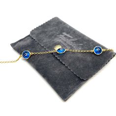 MELIGreece's memoir from the Greek islands, a 14k solid gold chain bracelet with three semi-transparent eye charms in a celestial blue color. Wearing a jewelry with an evil eye protects you from the negative energy around you. An easy to wear precious gold bracelet can be easily combined with your watch or your other bracelets. Yellow gold bracelet with three eye lucky charms in bright blue color with white and black enamel details, made in our workshop in Athens, Greece. Length of the bracelet: Elegant Evil Eye Bracelet With Adjustable Chain Gift, Elegant Round Chain Bracelet With Evil Eye, Elegant Round Evil Eye Chain Bracelet, Luxury Bracelets With Delicate Chain, Elegant Yellow Gold Evil Eye Bracelet Gift, Elegant Blue Chain Bracelet As Gift, Elegant Blue Chain Bracelet For Gift, Dainty Blue Chain Jewelry, Elegant Evil Eye Chain Bracelet Gift