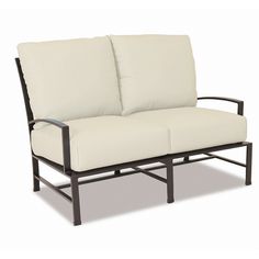 an outdoor loveseat with two cushions on it