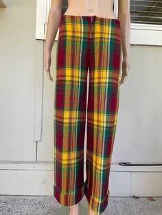 These vintage 70s Bay City Rollers-inspired bell bottom dress pants are a statement piece for any hipster wardrobe. Made from high-quality wool, the red and yellow check pattern adds a pop of colour to any outfit. With large turn ups they so remind me of the late 70s and a pair I used to wear - all the time! These dress pants are a size XS and are perfect on my size 8 mannequin. Fastening with a short zipper. for those who love a mix of vintage and city style. The pants feature a regular fit and Short Zipper, Bay City Rollers, Bay City, Stylish Pants, Bell Bottom Pants, Womens Jeans, Bell Bottom, City Style, Check Pattern